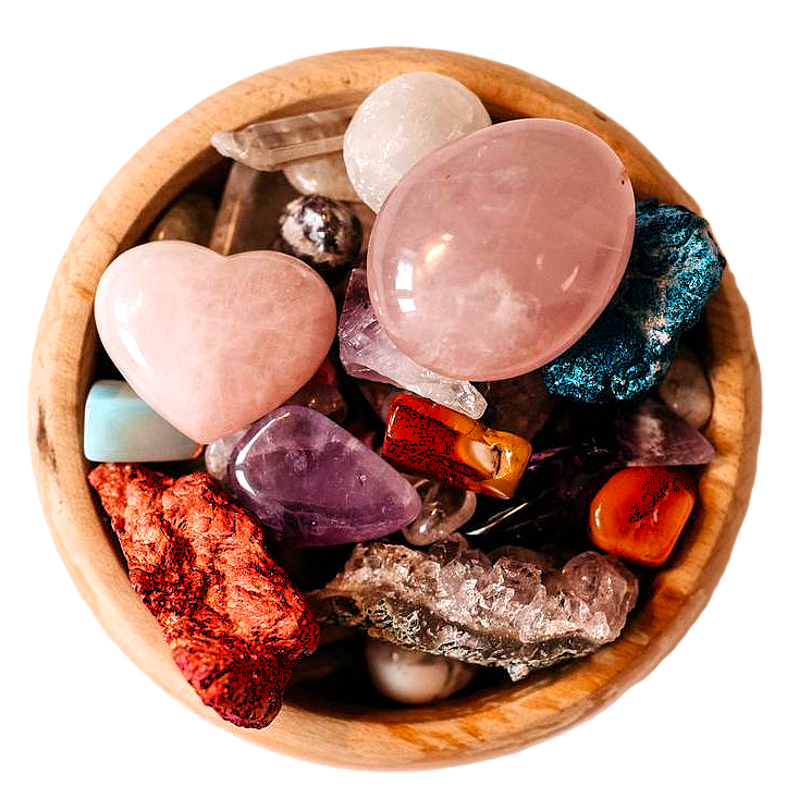 The Pebble Room logo with wooden bowl filled with colourful crystals viewed from above
